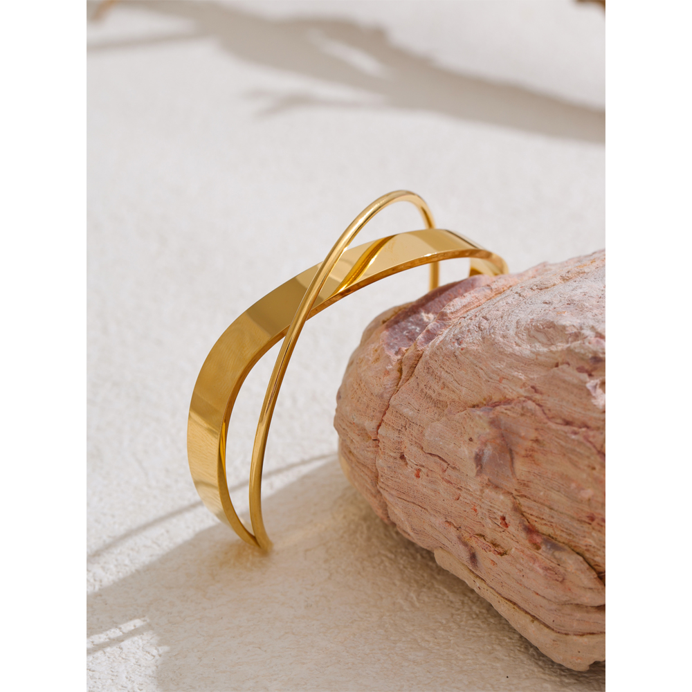 Mimi Bangle - 18K Gold Plated Criss-Cross Cuff Bracelet on stone